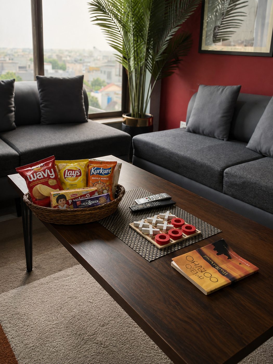 Basket of complimentary snacks and a board game on the coffee table